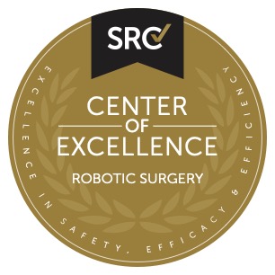 Insignia del Centro de Excelencia en Cirugía Robótica de SRC
