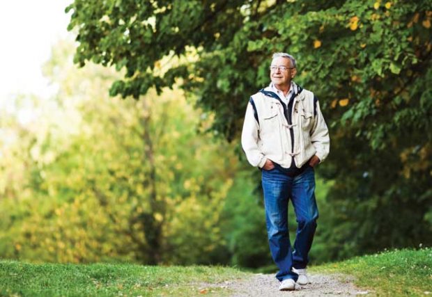 Older man walking outdoors