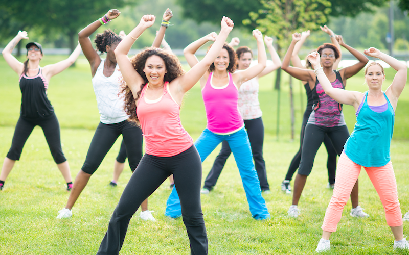 Several women taking an exercise class